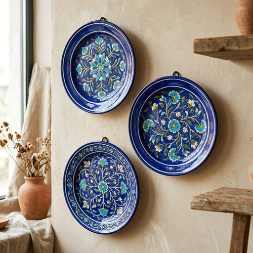 Blue Pottery Wall Plate Trio — angled view