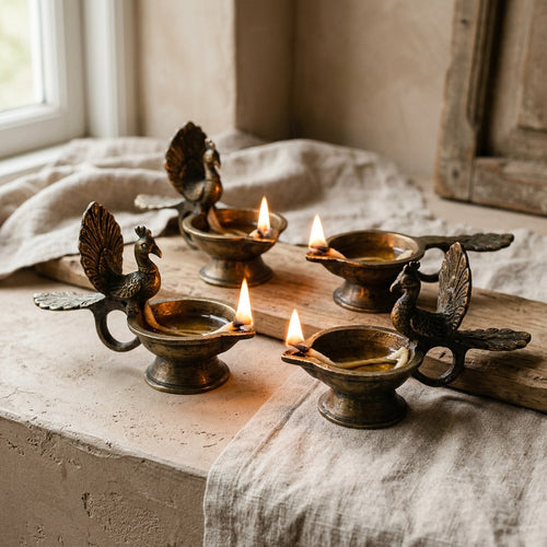 Brass Peacock Diya Set — angled view